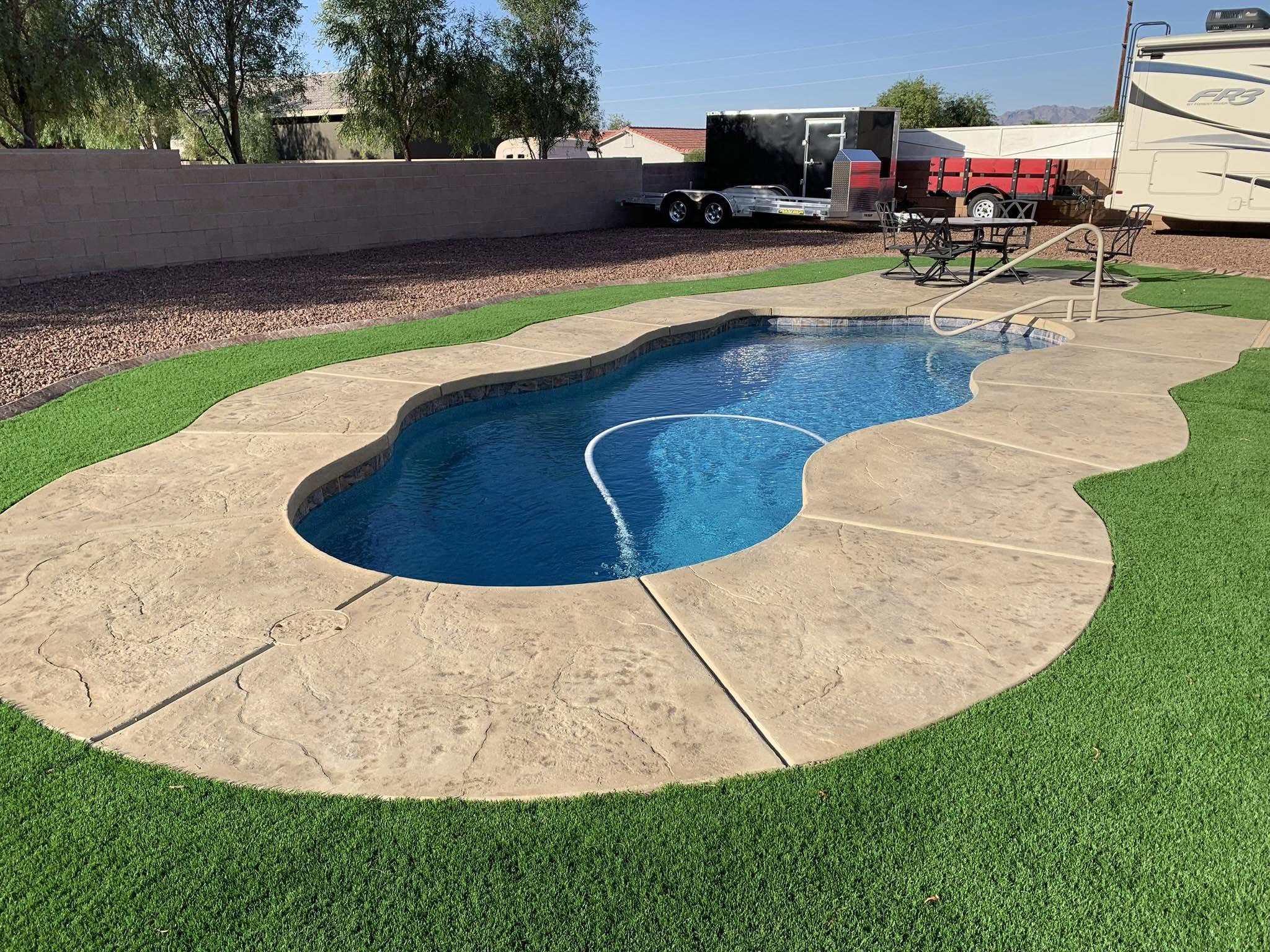 Finished pool deck with artificial turf in Bullhead City